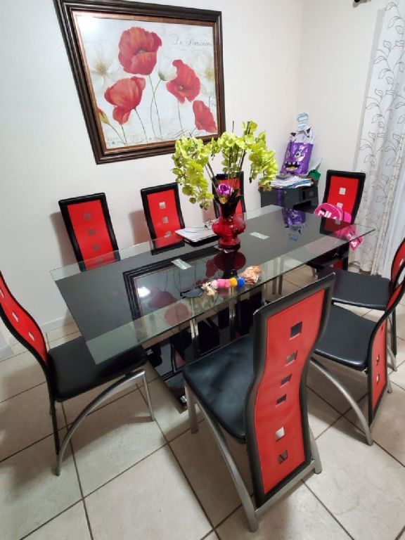 Table of 8 chairs , it is in use but in good condition.