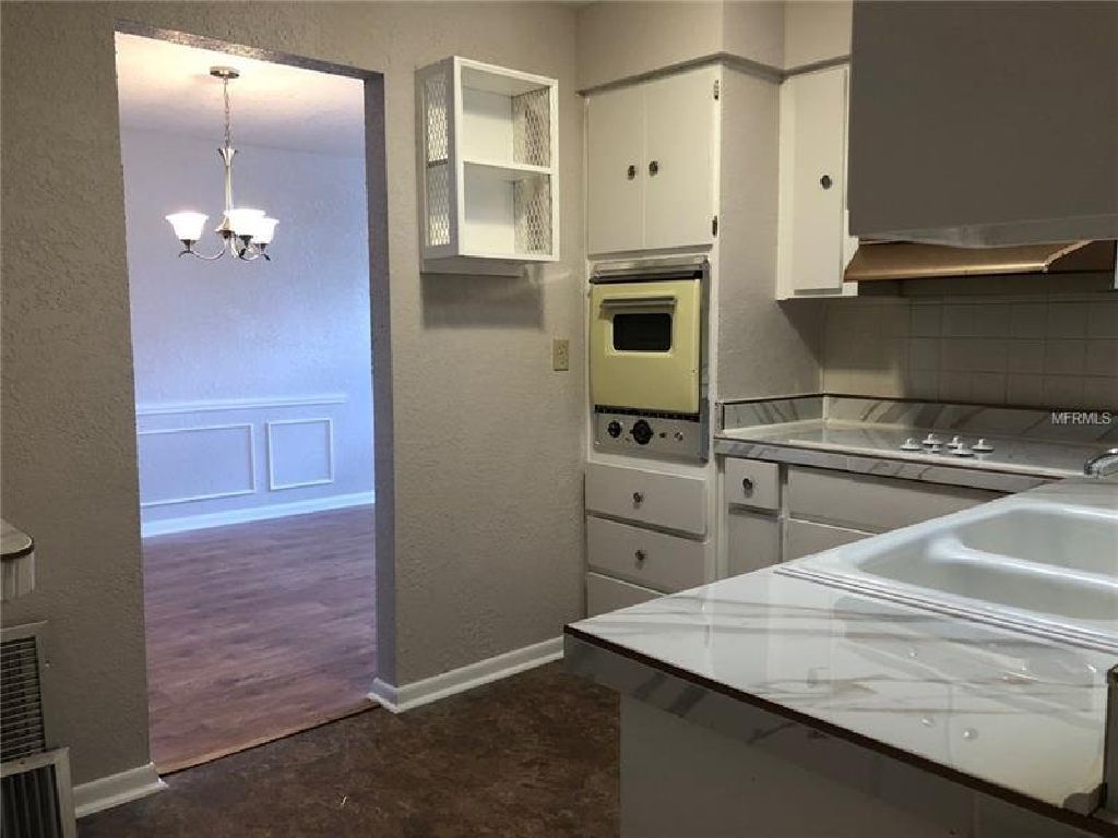 This home features newly painted exterior and interior, new kitchen with custom made wood cabinets.