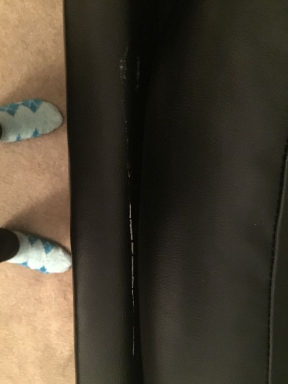 Black leather L-shaped sectional sofa w/ ottoman/storage.