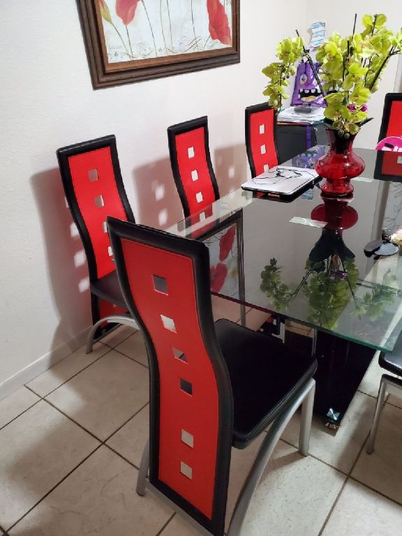 Table of 8 chairs , it is in use but in good condition.