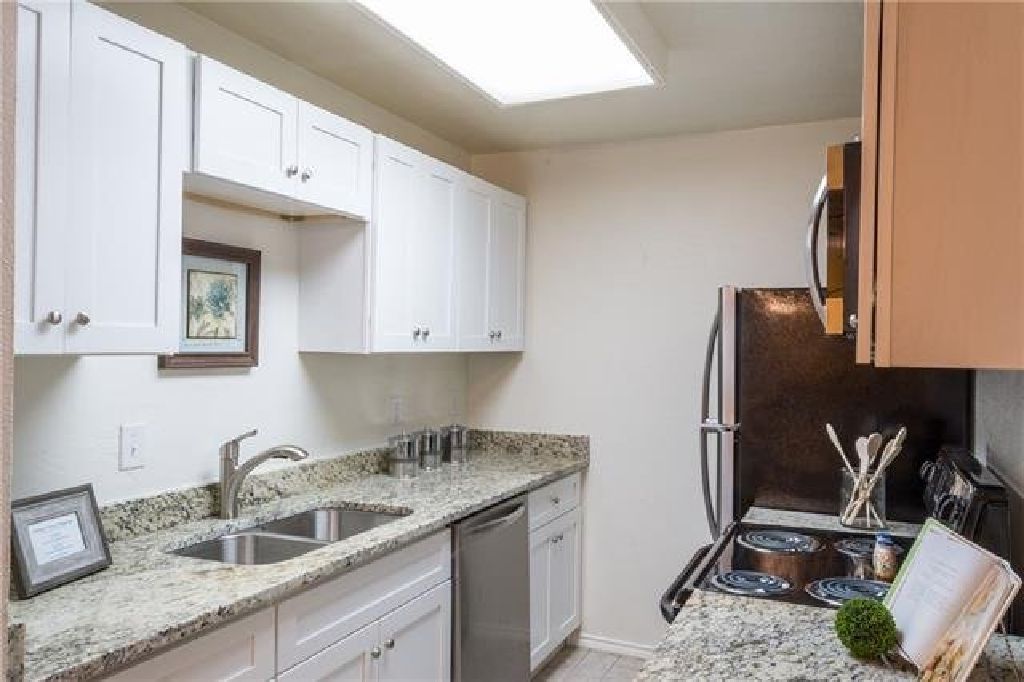 COME & SEE THIS MOVE IN READY CONDO
