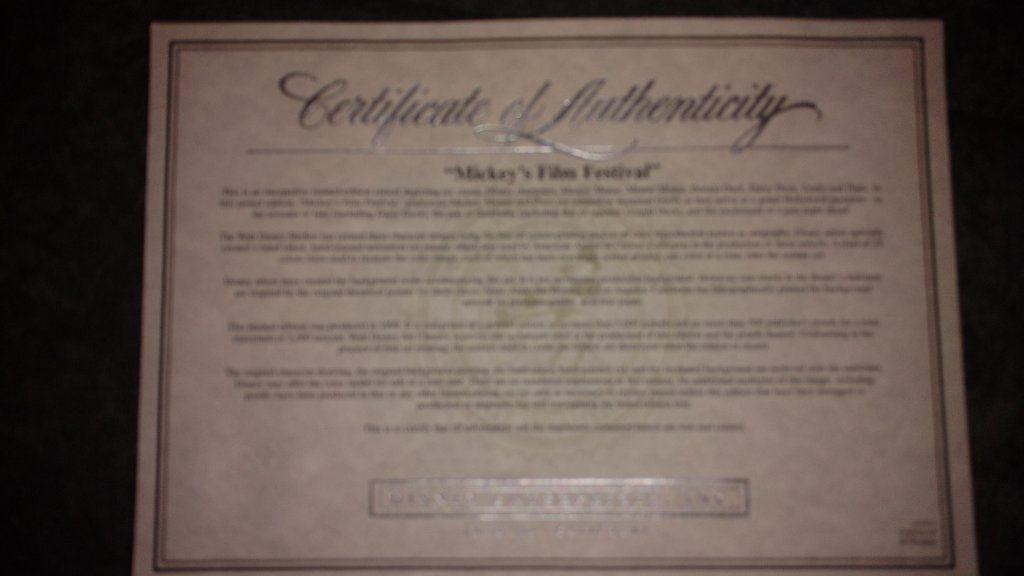 Disney collectible items with papers signed by artist