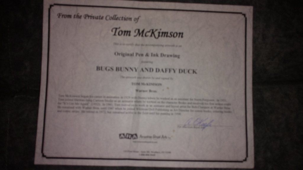 Disney collectible items with papers signed by artist