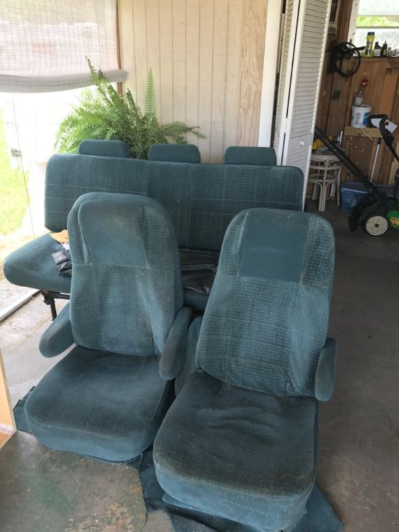 Two captain chairs and sofa