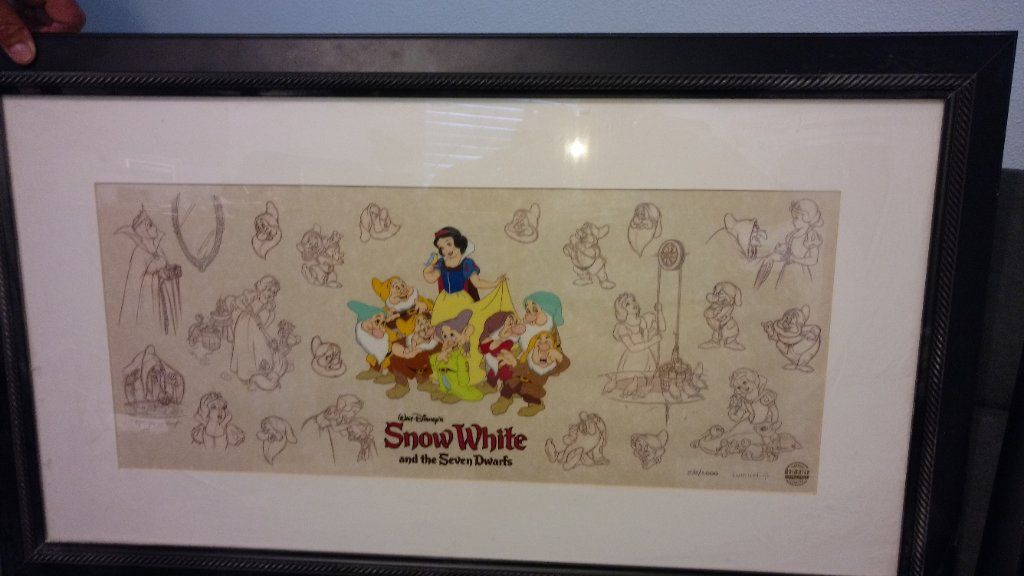 Disney collectible items with papers signed by artist