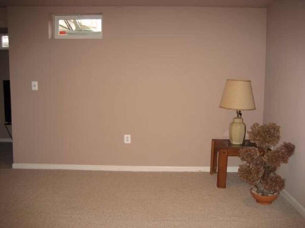 A furnished bedroom in basement for rent