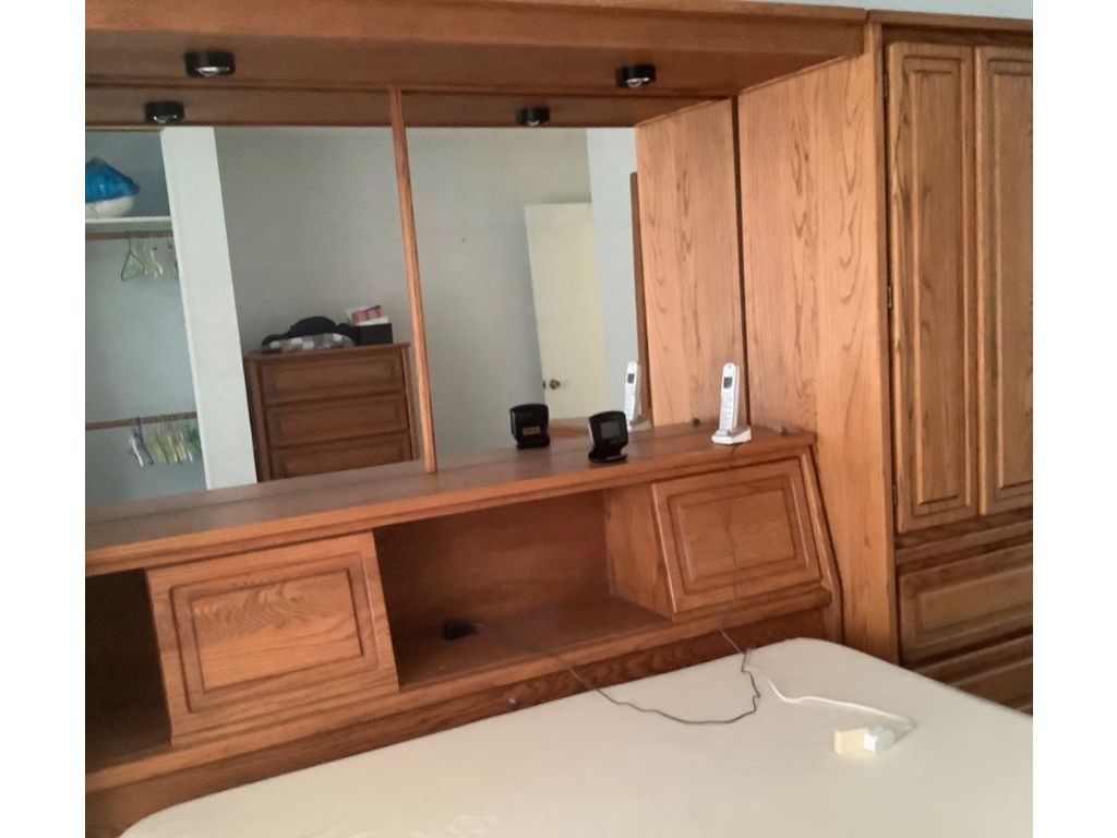 Free: oak queen bed frame with drawers built in shelves dressor mirror like new