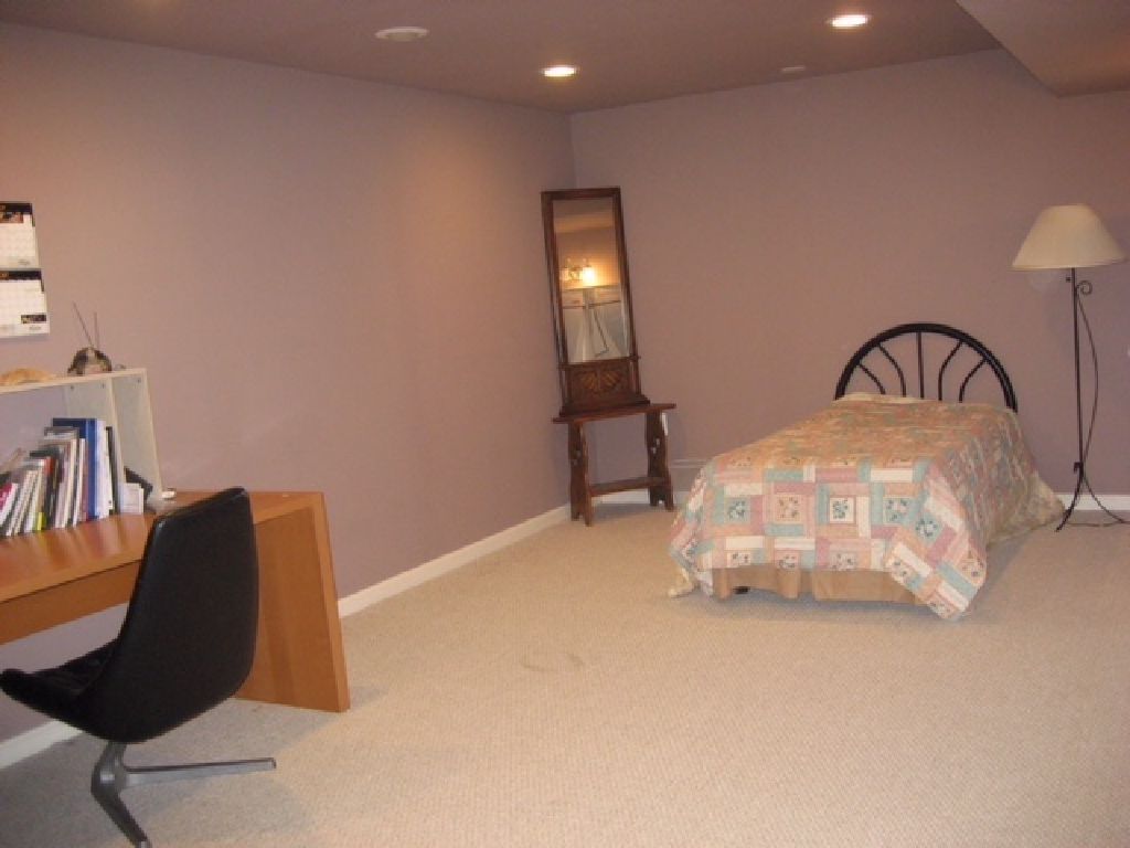 A furnished bedroom in basement for rent