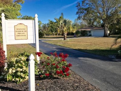 Like new 3/2 WATERFRONT home with dock and almost 1 acre lot in Alva