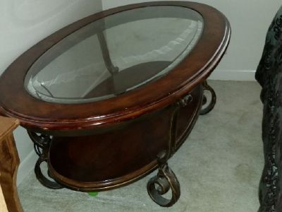 Beautiful Oval table Dark wood with glass piece.