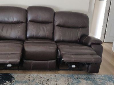 Fallen leather power reclining sofa with power headrests