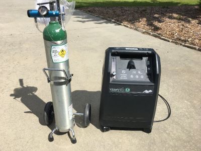 Oxygen consentrator and portable oxygen tank on wheels
