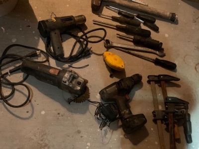 Bucket of tools . Drill, heat gun,