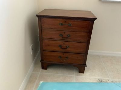 Inlaid antique wood small chest of drawers.