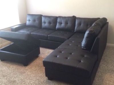 New in Box - 3 pc Reversible sectional with Cupholder and Storage Ottoman
