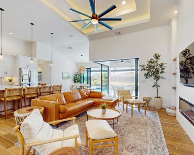 Avg / night: $311. Newly-built luxury home with private infinity pool, canal views, & washer/dryer | Located in Cape Coral, FL | 5.0 Stars | 4 Bed, 3 Bath | No Pets. No pets. Max 8 guests. Prominently positioned in the highly-desirable and upscale Surfside neighborhood, this newly-built coastal gem is ready to welcome you and your guests to Southwest Cape Coral. This sleek, stylish, open-concep...