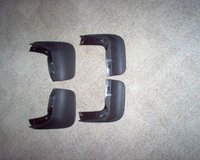 New front and rear mud guards that fit a 2011-2015 VW Jetta.