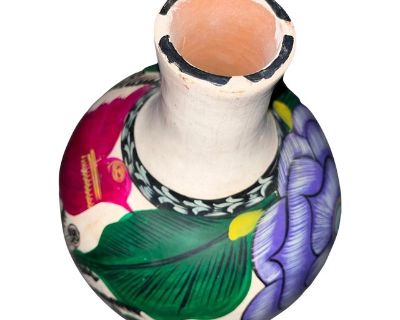 Vibrant Mexican style decorative vase. This somewhat primitive look vase is versatile in so many ways. It makes a great accent piece or use as focal point. Adds a splash of color to give life to a setting or can bring the colors in a room together giving a feeling of unity. 11" tall x 9" wide. Vibrant colors. Dimensions 9 W 9 D 11 H Styles Mexican Period 1990s Country of Origin United States It...