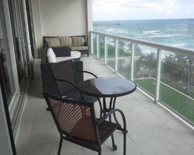 Luxury Contemporary Direct Ocean View. Furnished 2 B 2 Bath With Office/Den. New Kitchen, New Flooring. Located in a 5 star Resort Style Full Service Building including Security, Concierge, - 2 Heated Swimming Pools, Tennis Courts, Valet, Spa & Fitness Center, Floor to ceiling Windows Ocean views from all rooms. Washer/Dryer Everything you need for your busy Lifestyle. Included in the Rent; Cab...