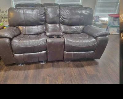Used Leather Rocking Recliner Loveseat.
