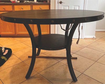 Round Kitchen Table with Three Blue Chairs