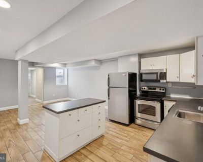 1440 Fairmont St NW Apt 1. Welcome home to this beautifully renovated two-bedroom, two-bathroom terrace-level apartment that perfectly combines modern style with everyday comfort. The open floor plan features a spacious living area flowing into a sleek modern kitchen with white cabinetry, stainless steel appliances, and a center island-ideal for cooking, entertaining, or casual dining. Each bed...