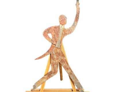 A Portrait of a Gentleman Artisan crafted figure of a formal gentleman making a toast. Plates of steel with detailing and relief, depicting the tuxedo, tail, the labels of his dinner jacket, fine formal shoes, tails, a ruffled shirt, and of course - the glass of champagne, Fantastic patina and aging to the metal and artisan touches. And, it is double sided - each side presents a slightly differ...