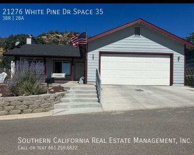 21276 White Pine Dr Space 35. Located in the gated community of Golden Highlands, this lovely 3-bedroom, 2 bath home features an open floor plan with good size living room, dining area and indoor laundry room. The dining room has a sliding glass door that opens to the covered patio. Enjoy entertaining on the patio while watching the abundant wildlife or sit on the front swing on the front porch...