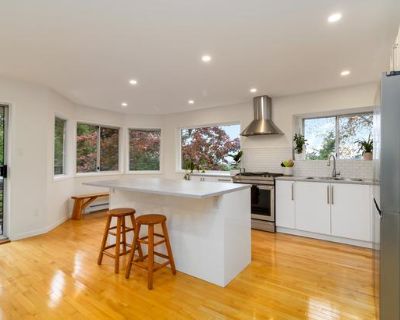 The top/main level of this exceptional and recently modernized Strawberry Vale home provides a great family layout, and also a great option for empty-nesters, downsizers, or retirees that want one-floor living and easy entry. The home offers stunning views of the Portage Inlet and Olympic Mountains from the grand open kitchen and dining room, an area that s complete with a balcony to enjoy morn...