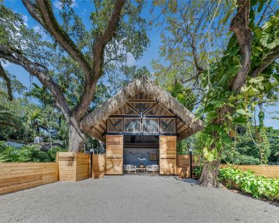 NW 9th Ct. Welcome to Jungle Book, a fully furnished 3-bed, 5-bath architectural masterpiece in historic Spring Garden. Designed by Trelles Cabarrocas Architects, this unique home sleeps 8 comfortably and offers a true wellness-style retreat in a lush jungle setting just minutes from Miami s dining, shopping, beaches, and nightlife. Features include a steam shower, outdoor soaking tub, cold plu...