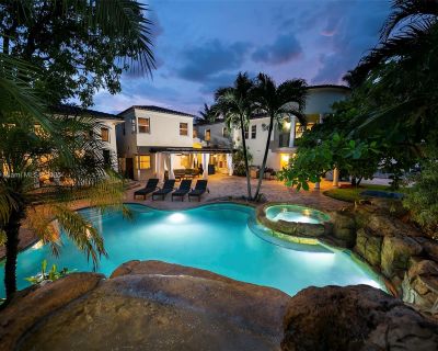 NE 89th St. Unique architecture combines elements of modern style on the inside, while elements of Tudor\r\nand Mediterranean Revival encompass this exclusive retreat with full 7 bedroom plus a movie\r\ntheater, 5 and a two half bathroom private and personal resort. Villa Justina features a huge\r\neat-in chefs kitchen, family room with HD TV and games, dining room with soaring ceilings,\r\npar...