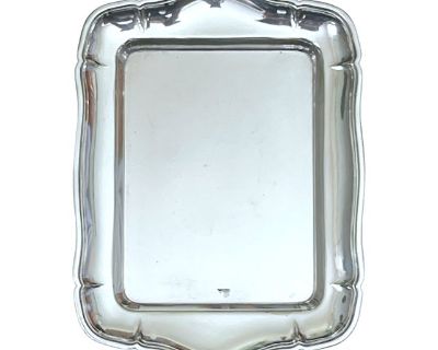 20th Century silver tray featuring an elegant scalloped border and smooth polished surface. Measuring 7" x 5", this versatile piece is the perfect size for cocktails, petit fours, or as a catchall a vanity or entry console. The tray features a maker s mark with a crown motif and the letter A, suggesting European manufacture possibly Italian or Spanish 20th century silver or silverplate. Its ref...