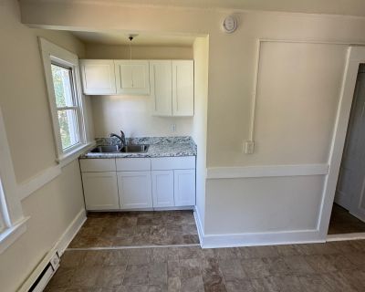 57 Rhodes Street. Attic-style 2-bedroom apartment with sloped ceilings and abundant natural light. Features newer appliances, freshly painted interiors, efficient electric heat, and off-street parking. Move-in ready and conveniently located in a quiet building. Available now!. 7 Bedroom. 3 Bathroom. 3016 ft