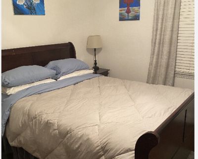 I have hosted long term stays in my guest room since I bought the house. There is a queen-size bed, desk, dresser, two closets, and a shared bathroom. Pets are welcome, and I have dog crates for your use. You will have a shared bathroom, in-home gym, and full kitchen for your use. The washer and dryer is available for your use, and I have the house professionally cleaned weekly.. 1 Bedroom. 1 B...
