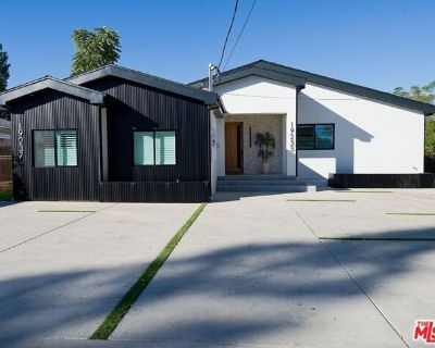 19235 Strathern St. Score! New high-end construction in the highly sought-after Reseda Ranch neighborhood with 4 large bedrooms, each with an en-suite, plus a guest bathroom. Each bedroom contains a walk-in closet. The "everything new" property provides seamless outdoor and indoor living on a 10,000+ sq ft lot with a pool, a spa, a covered outdoor BBQ grill and pizza oven kitchen with quartz co...