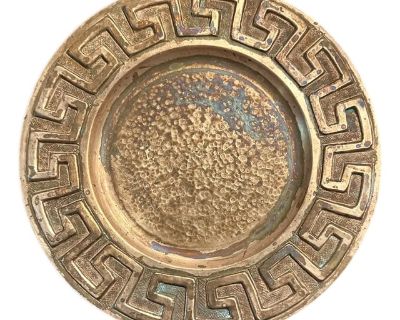 A handsome, hammered copper vide poche. Features a round copper vessel with Greek key decorations to the outer rim. Hand hammered. Stamped to the verso. Unpolished with original aging and patination. Circa 1970.. Dimensions 8.5 W 8.5 D 0.5 H Styles Arts & Crafts Mid-Century Modern Transitional Period Late 20th Century Country of Origin Mexico Item Type Vintage, Antique or Pre-owned Shop Sustain...