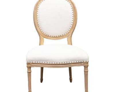 Oval back Louis XVI side chair in distressed and dry brushed light finish. Neutral upholstrey with tack trim and contrasting upholstry on the outside back panel. Seat cushion has some discoloration.. Dimensions 25 W 25.5 D 42 H Styles Louis XVI Seat Interior Width 25.0 in Seat Height 19.0 in Seat Interior Depth 21.0 in Number of Seats 1 Period Late 20th Century Country of Origin United States I...