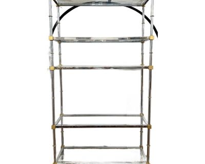 This mid-century chrome and brass tag re with a sleek chrome-plated steel frame and gleaming solid brass corners and finials had a luxe two-tone look. Five clear glass shelves provide ample display space for books, objets d art, or barware.. Dimensions 42 W 14.5 D 78 H Styles Mid-Century Modern Period Mid 20th Century Country of Origin United States Item Type Vintage, Antique or Pre-owned Shop ...