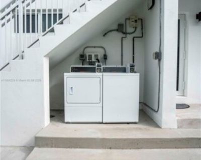 1850 S Treasure Dr Apt 5. Enjoy this luxurious residence in the quiet neighborhood of North Bay Village. This JUST renovated apartment features wood toned flooring, kitchen with SS appliances and granite countertops, IMPACT windows and doors, central A/C, spacious front porch, updated bath, and in-unit washer + dryer. The bedrooms offer a breathtaking waterfront view through floor-to-ceiling gl...