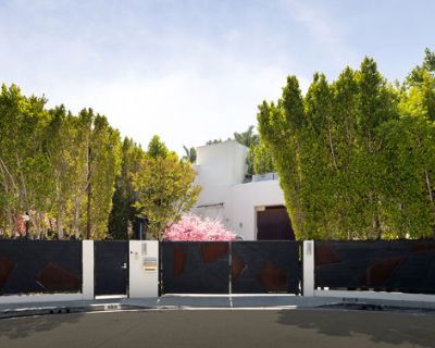 Hythe Court. Introducing LUMINOSITY, an eclectic celebration of color and light, a vivid sanctuary of artistic splendor, an exotic play-place for all ages. Concealed behind gates and privacy hedges, this bedazzling compound promises pops of color everywhere, beginning with a dramatic stone pathway set beneath geometric arches and flanked by dual fire pits atop a reflecting pool with cherry blos...