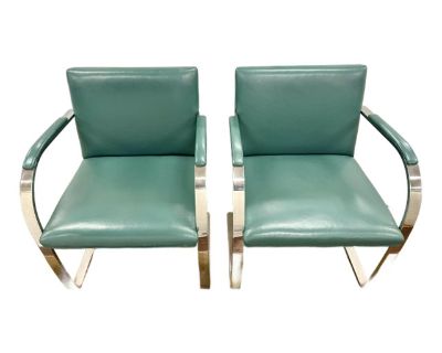 Pair of iconic BRNO Mid Century Flat Bar Leather Chairs, a celebrated design classic first introduced by Ludwig Mies van der Rohe in 1930. These feature striking cantilevered silhouettes, its heavy polished flat bar steel frame supports lush leather upholstery in a sophisticated teal hue.. Dimensions 23 W 22 D 31.5 H Styles Mid-Century Modern Number of Seats 2 Seat Height 17.5 in Designer Ludwi...
