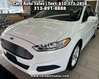 Get ready to cruise in style and comfort with this sleek 2014 Ford Fusion! This front-wheel-drive beauty boasts a sporty 3.07 axle ratio that will have you zipping around town with ease. Equipped with a fuel-efficient gas engine and electric power-assist steering, this car provides a smooth and responsive driving experience. The Fusion's striking exterior features body-colored accents, chrome t...