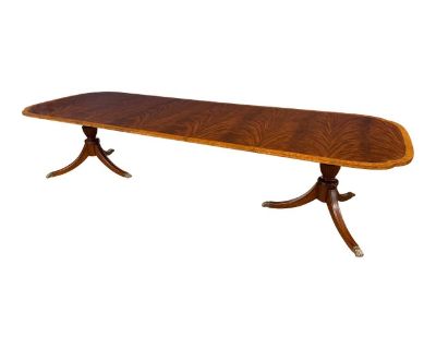 This is the LH-9-3L(SW) Scallop Cornered Mahogany Dining Table by Leighton Hall. It is one of Leighton Hall s most popular dining tables. It features delicately sculptured scalloped corners, a field of swirly crotch mahogany and a satinwood border. It has a hand steel wool rubbed satin finish which allows it to fit in well with existing antiques. The each pedestal has three fluted legs which te...