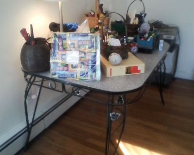 free vintage 50s kitchen table w/ w/ ornamented base & legs + recumbent tunturi exercise bike