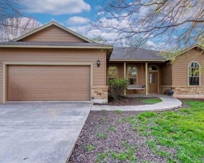 212 Waikakaaua Dr. Welcome to this beautiful house on a half an acre of land! Ceramic floors lead you through the sunlit open floorplan, while the bedrooms offer a touch of cozy carpet underfoot. The thoughtful in-law floor plan ensures the main suite gets its own peaceful corner, set apart from the other bedrooms. Need extra space? There is plenty with the oversized 2-car garage with workspace...