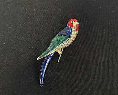 Vintage 1980's parrot pin/brooch decorated with red/blue/green enamel, and green crystal for the eyes