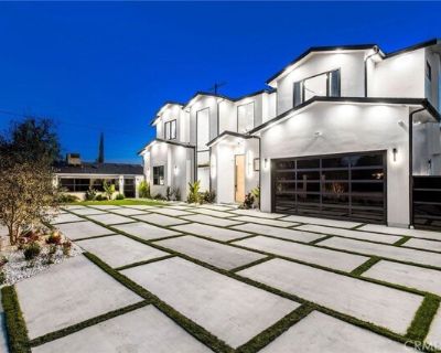 22745 Califa St. Stunning Luxury Estate in Walnut Acres Over Half an Acre of Elegance and Opportunity! Discover the perfect blend of sophistication, privacy, and income potential in this newly constructed gated estate. Nestled on a sprawling lot in the coveted Walnut Acres neighborhood, this exceptional property features a grand 6, 387 sq ft main residence. Main Residence Highlights: Elegant De...