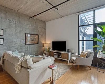 Lease term: Month to Month. $1650/month 1/2 Month Security Deposit. Furnished Rental. Experience modern loft living in this stunning 4th-floor condo located in the heart of downtown Charlestons East Central neighborhood. This 1-bedroom, 1-bath unit includes a versatile flex room--perfect for a second bedroom, home office, or additional living area. Soaring ceilings, exposed concrete accents, an...