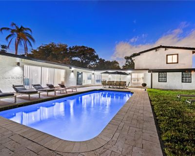 Polk St. Fabulous luxurious two-story retreat in Hollywood Hills. This fully furnished and stocked 8-bedroom, 6.5-bathroom home offers 4,990 sqft of resort-style living. Features an open layout, central air, in-unit laundry, and chic finishes. Step outside to your private oasis: a heated pool, circular driveway, and fenced yard create an entertainer s paradise. Pet-friendly and available for bo...