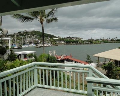 45-217 Mahalani Cir. 24 HOUR VIEWS! Bay, Ocean, Mountain and Coastline. Waterfront home with large windows offering spectacular views of Coconut Island, K-Bay * Koolaus.. Spacious lower level ofers many possibilities for visiting family-guests , 2cd family rm, with its own entrance and sliding glass door to covered lanai area. ENJOY lounging on spacious open deck overlooking the bay, snooze und...